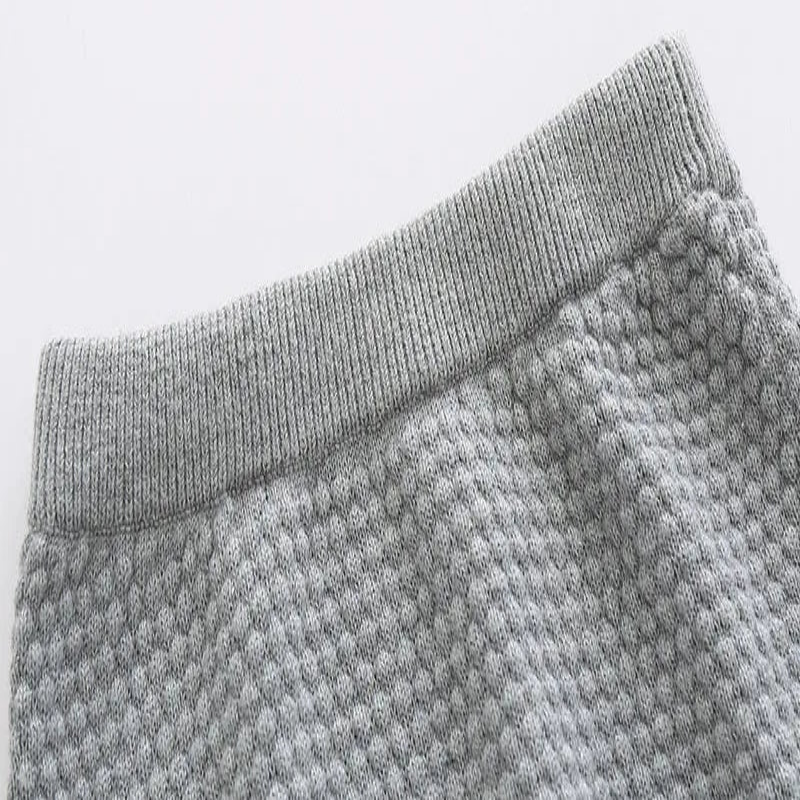 Close up of grey sweater pants waistband