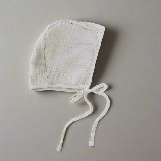 Grey muslin bonnet laying flat