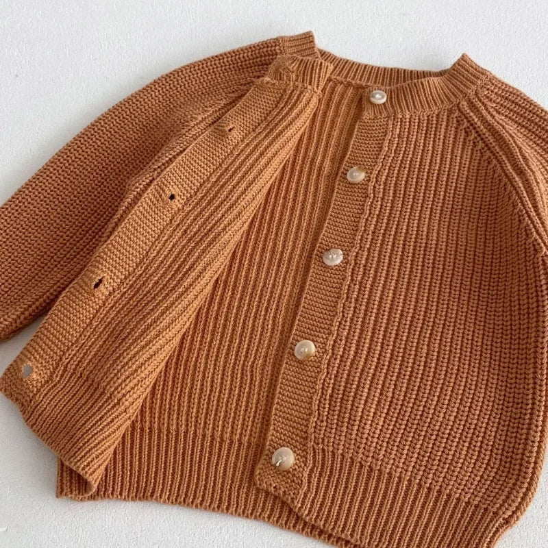 Knitted cardigans in brown opened showing inside