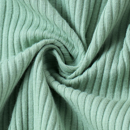Long sleeve ruffle romper in green close up of fabric