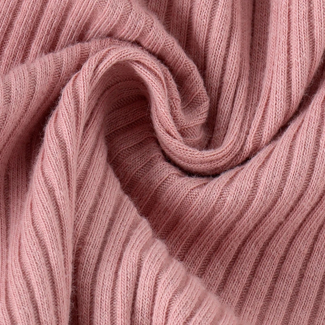 Long sleeve ruffle romper in pink close up of fabric