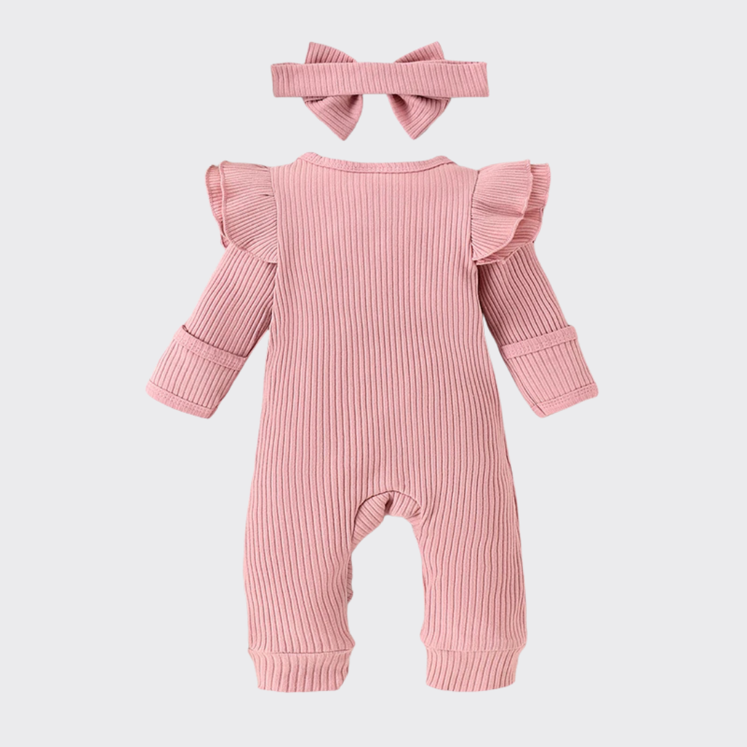 Long sleeve ruffle romper in pink with bow headband back view