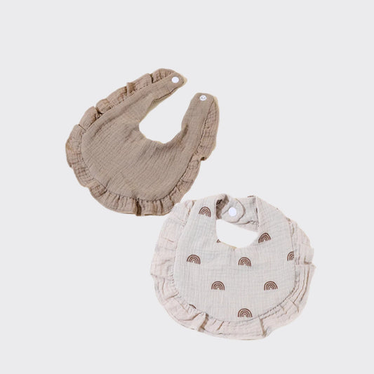 Pair of muslin burp clothes in brown and cream colored with brown rainbow