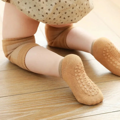 anti-slip socks and knee pads worn by child