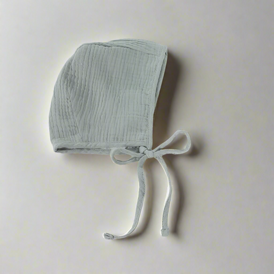 Sea green colored muslin bonnet side profile
