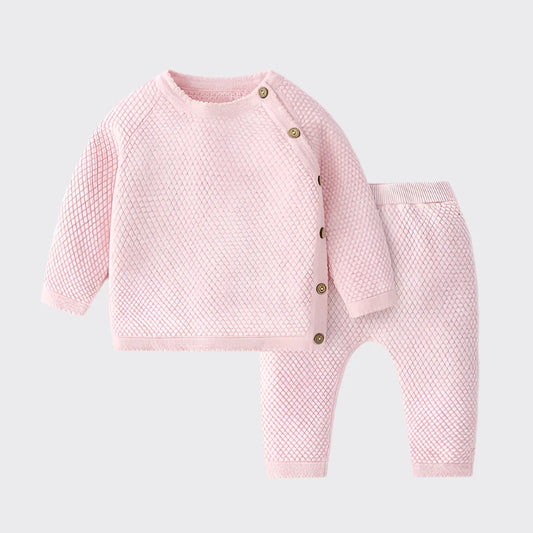 Sweater set in pink with brown buttons along side of sweater top