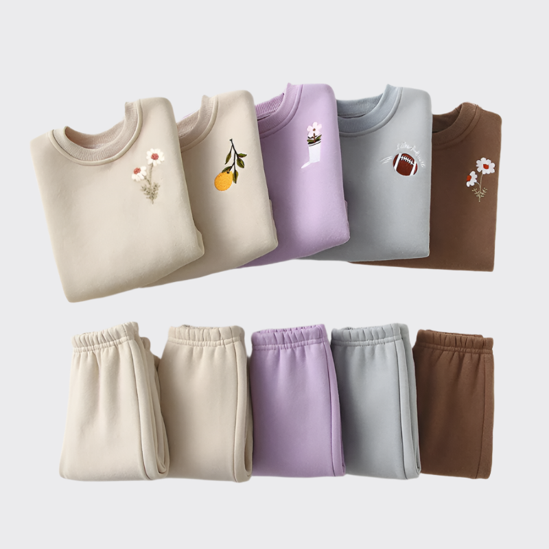 Sweatshirt and pants sets in cream, cream, purple, blue, and brown, with daisy, lemon, flower, football, and daisy respectfully